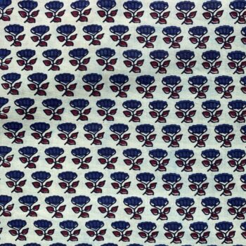White fabric with blue flower and red leaves