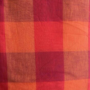 Handwoven Madras Kattam cotton fabric with large orange, red, rust and burgundy checks